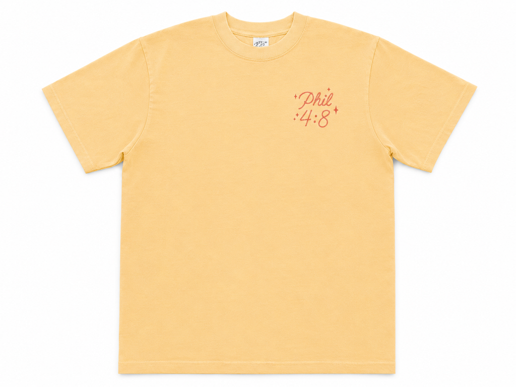 Cotton Collective Vintage Sunflower oversized tee, front view, pale mustard yellow with "Philippians 4:8" in red saddle script on the left chest.