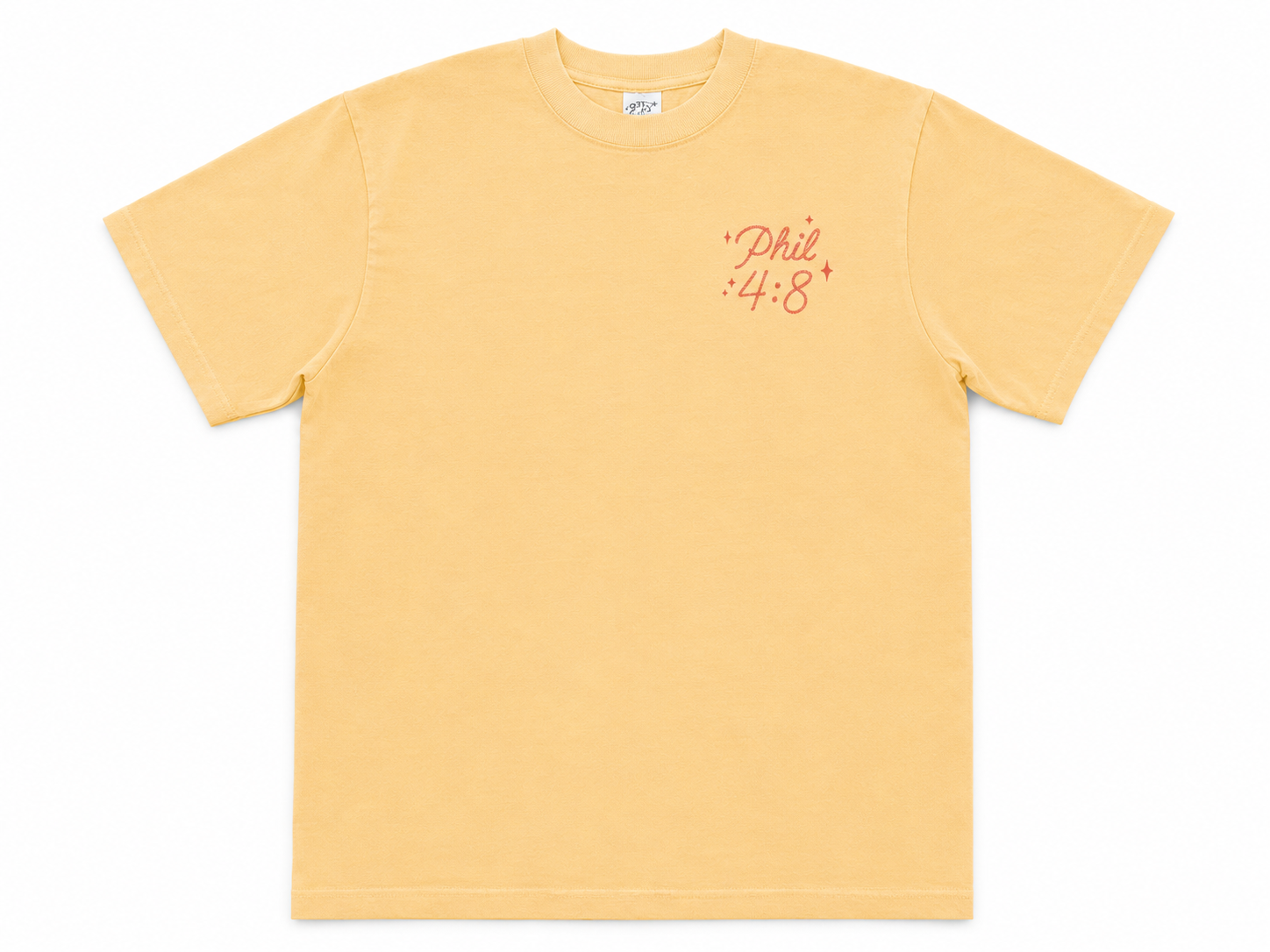 Cotton Collective Vintage Sunflower oversized tee, front view, pale mustard yellow with "Philippians 4:8" in red saddle script on the left chest.