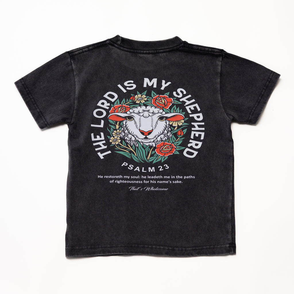 Black adult t-shirt with a sheep and floral graphic, 'The Lord Is My Shepherd' and 'Psalm 23' text on the back