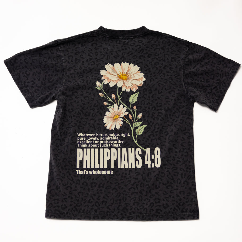 Black leopard-print t-shirt with a floral graphic and 'Philippians 4:8' text on the back